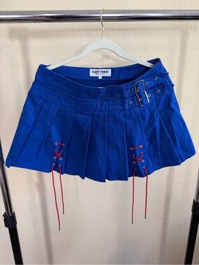 Blue Pleated Mini Skirt with Red Lace-Up Detail
